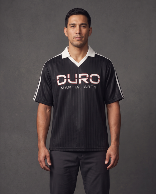 DURO Martial Arts Club Jersey modeled against a charcoal studio background — AI-generated styling image