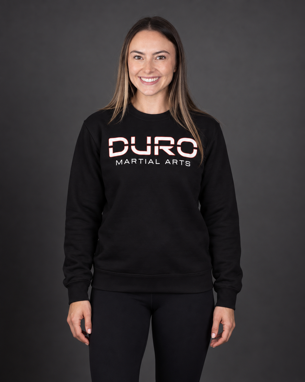 Alexa modeling the black DURO Martial Arts Premium Training Crewneck — AI-assisted studio image