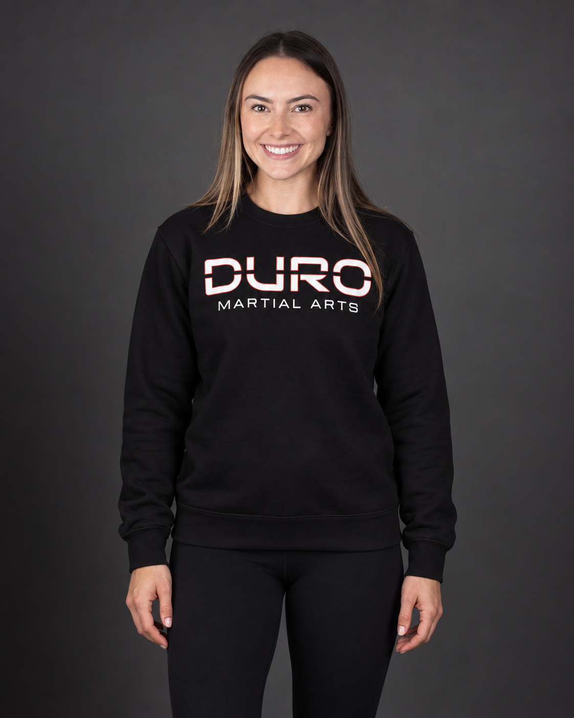 Alexa modeling the black DURO Martial Arts Premium Training Crewneck — AI-assisted studio image