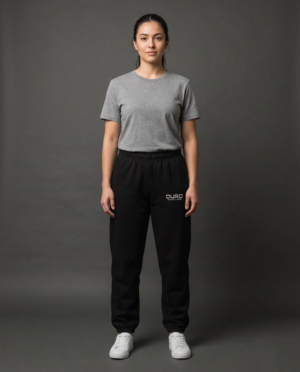 DURO Martial Arts Heavyweight Sweatpants modeled against a charcoal studio background — AI-generated styling image