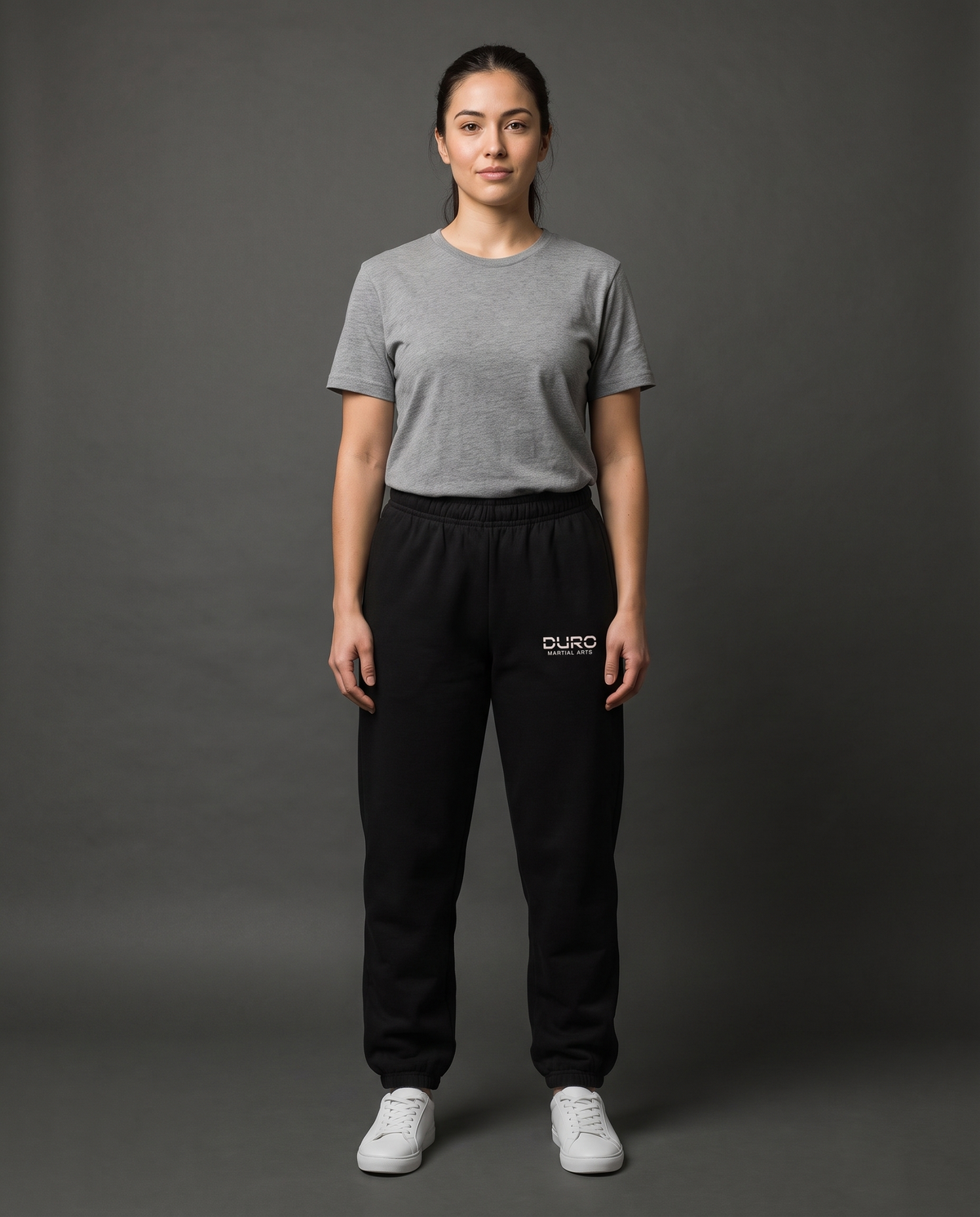 DURO Martial Arts Heavyweight Sweatpants modeled against a charcoal studio background — AI-generated styling image