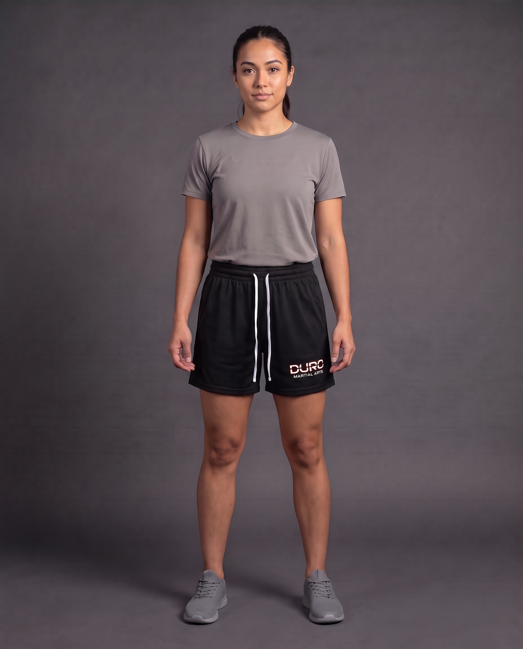 DURO Martial Arts Mesh Shorts modeled against a charcoal studio background — AI-generated styling image