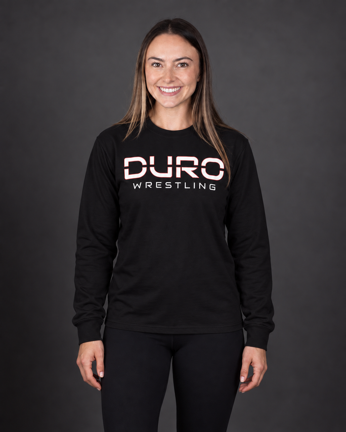 AI-assisted studio image of Alexa modeling the black DURO Wrestling Everyday Long Sleeve Tee