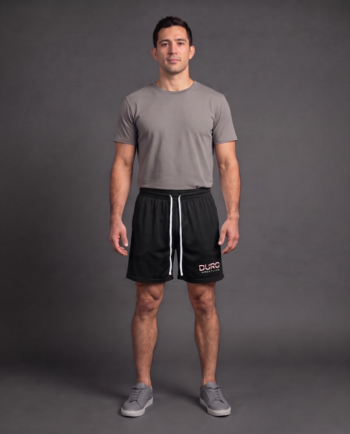 DURO Wrestling Mesh Shorts modeled against a charcoal studio background — AI-generated styling image