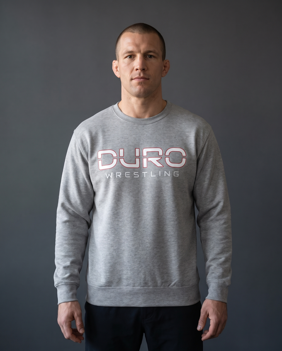 DURO Wrestling Premium Training Crewneck modeled against a charcoal studio background — AI-generated styling image