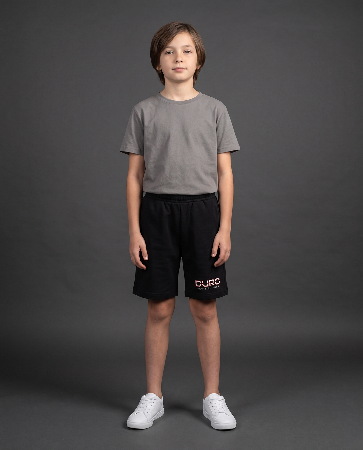 DURO Youth Martial Arts Cotton Shorts modeled against a charcoal studio background — AI-generated styling image