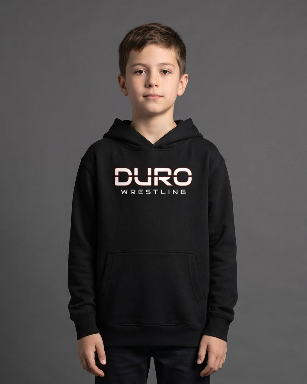DURO Youth Wrestling Premium Fleece Hoodie modeled against a charcoal studio background — AI-generated styling image