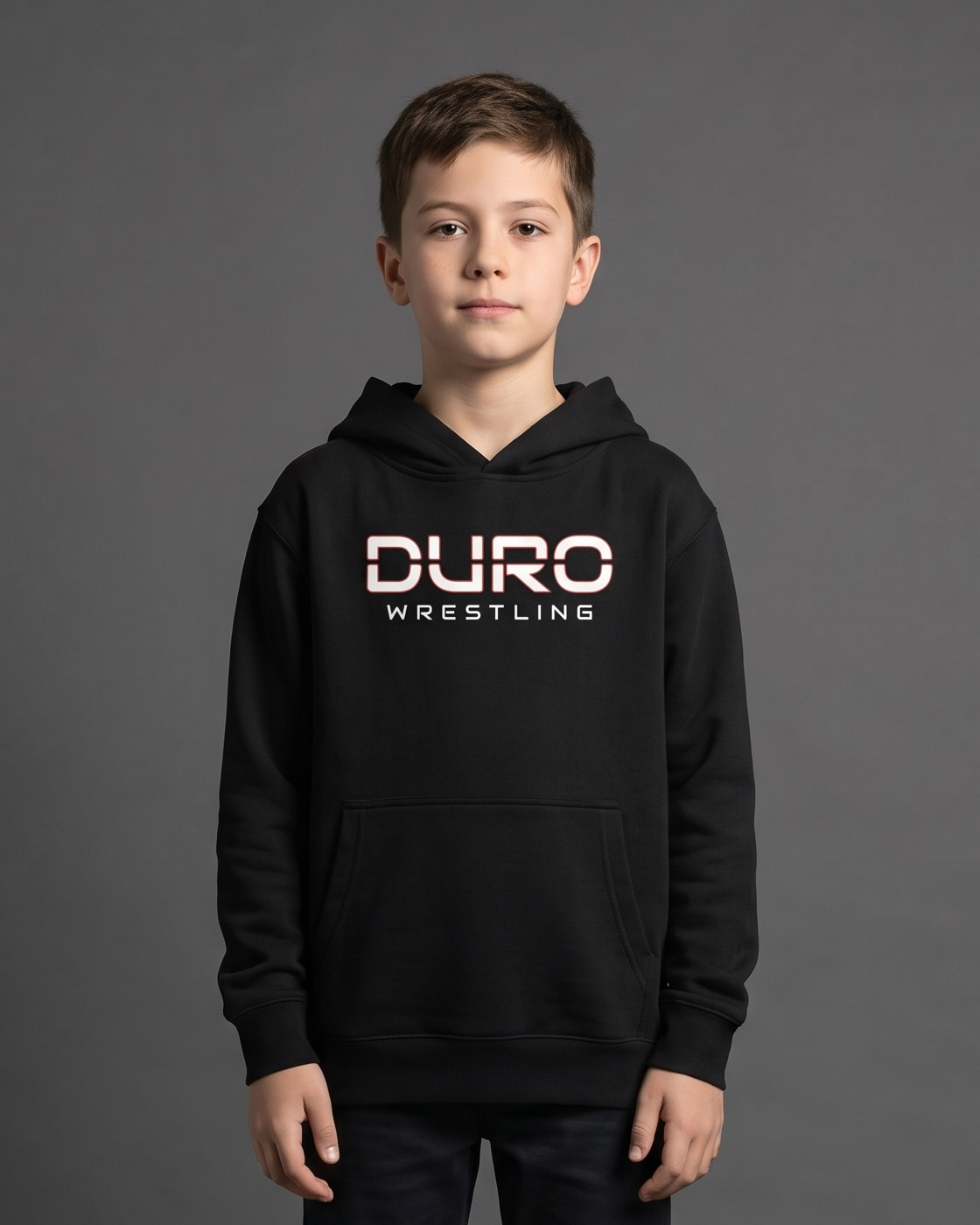 DURO Youth Wrestling Premium Fleece Hoodie modeled against a charcoal studio background — AI-generated styling image
