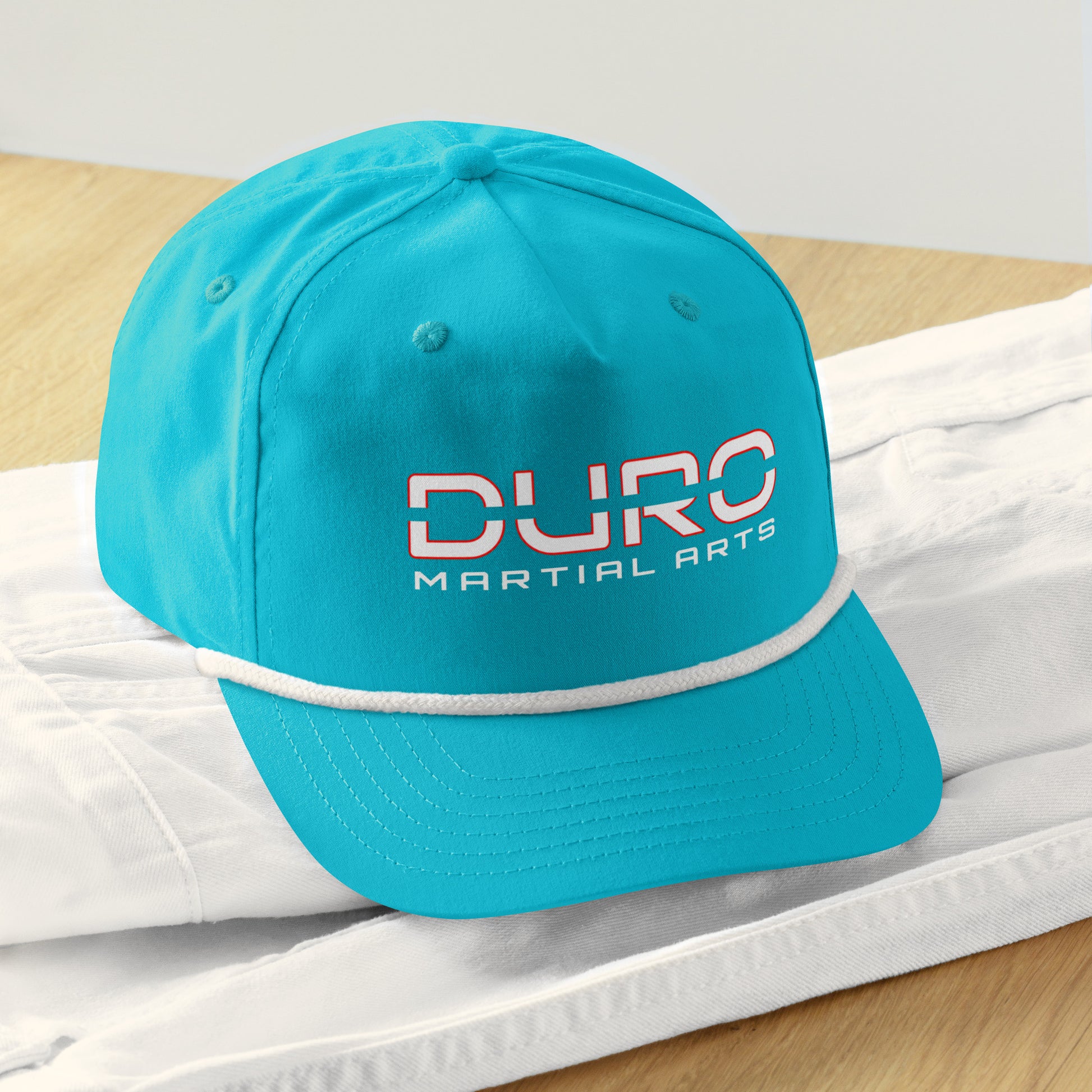 DURO Martial Arts 5-panel rope cap in turquoise and white, front view